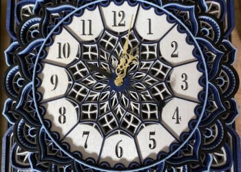 blue and white wooden laser cut clock