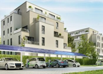 Electric vehicles charging near an apartment complex