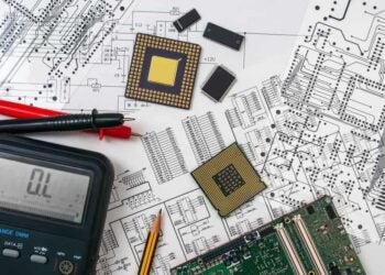 View of schematic, components, board, LCR meter indicating PCB development.