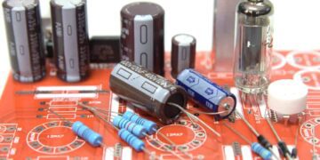 Loose and soldered components on PCB.