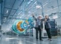 Industrial engineers visualize 3D CAD model of clean energy engine