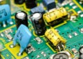 View of PCBA showing chip, ceramic, and electrolytic caps.