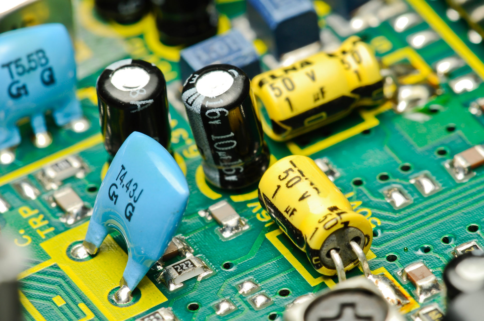 View of PCBA showing chip, ceramic, and electrolytic caps.