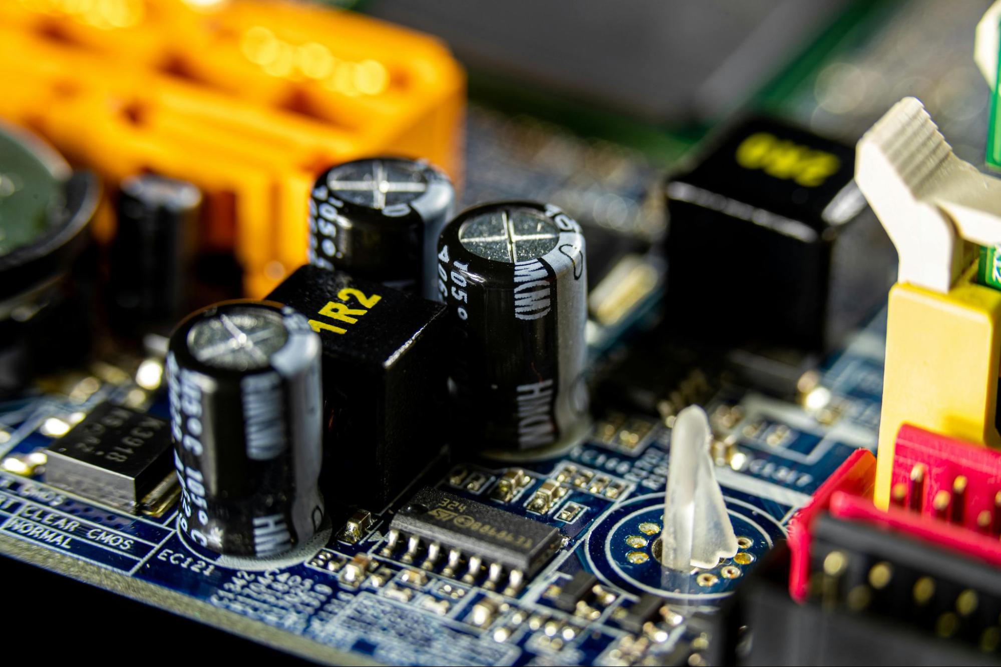 PCB circuit board showing capacitor layout considerations for designing long-term component availability 